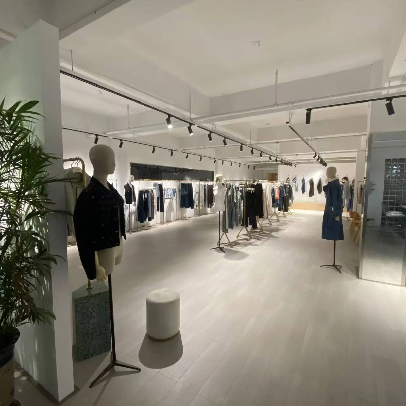 Denim jackets on mannequins and racks in the in-house style showroom