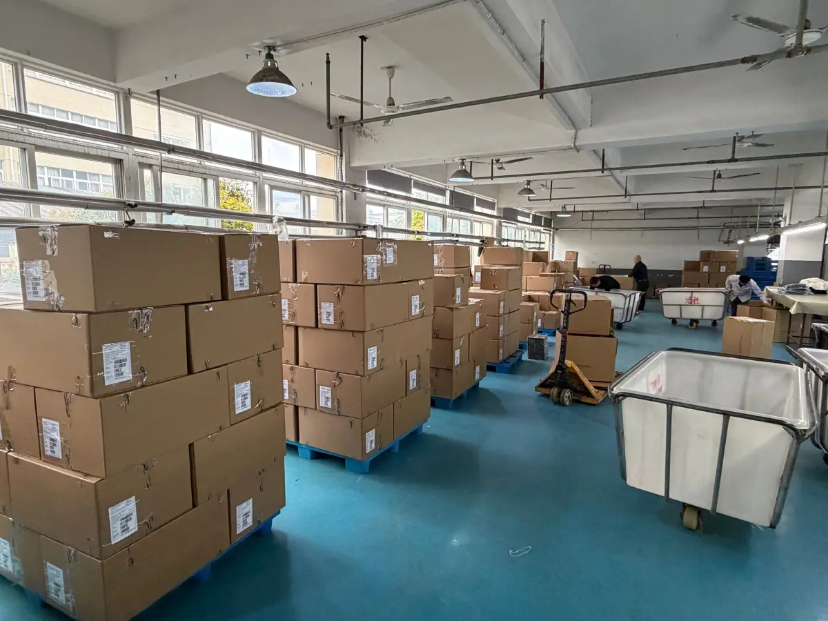 Cartons of finished garments stacked on pallets ready to ship
